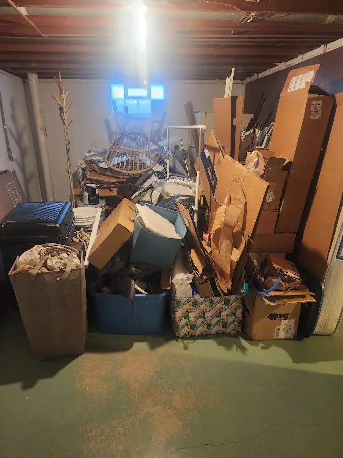 Roll-off dumpster container at job site for 2 Yard Dumpster Rental in Blue Earth